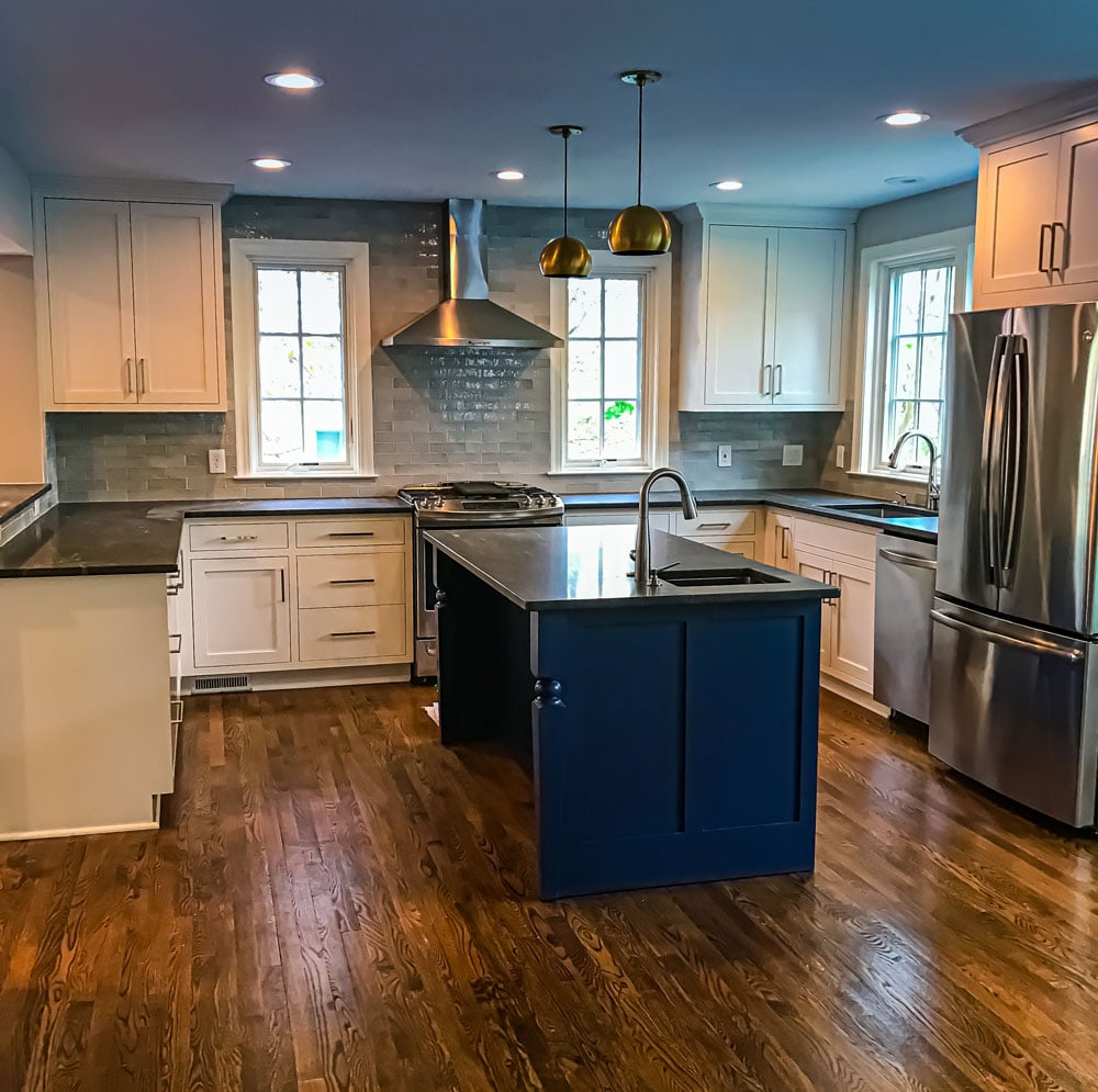 navy and grey kitchen with stainless steel appliances